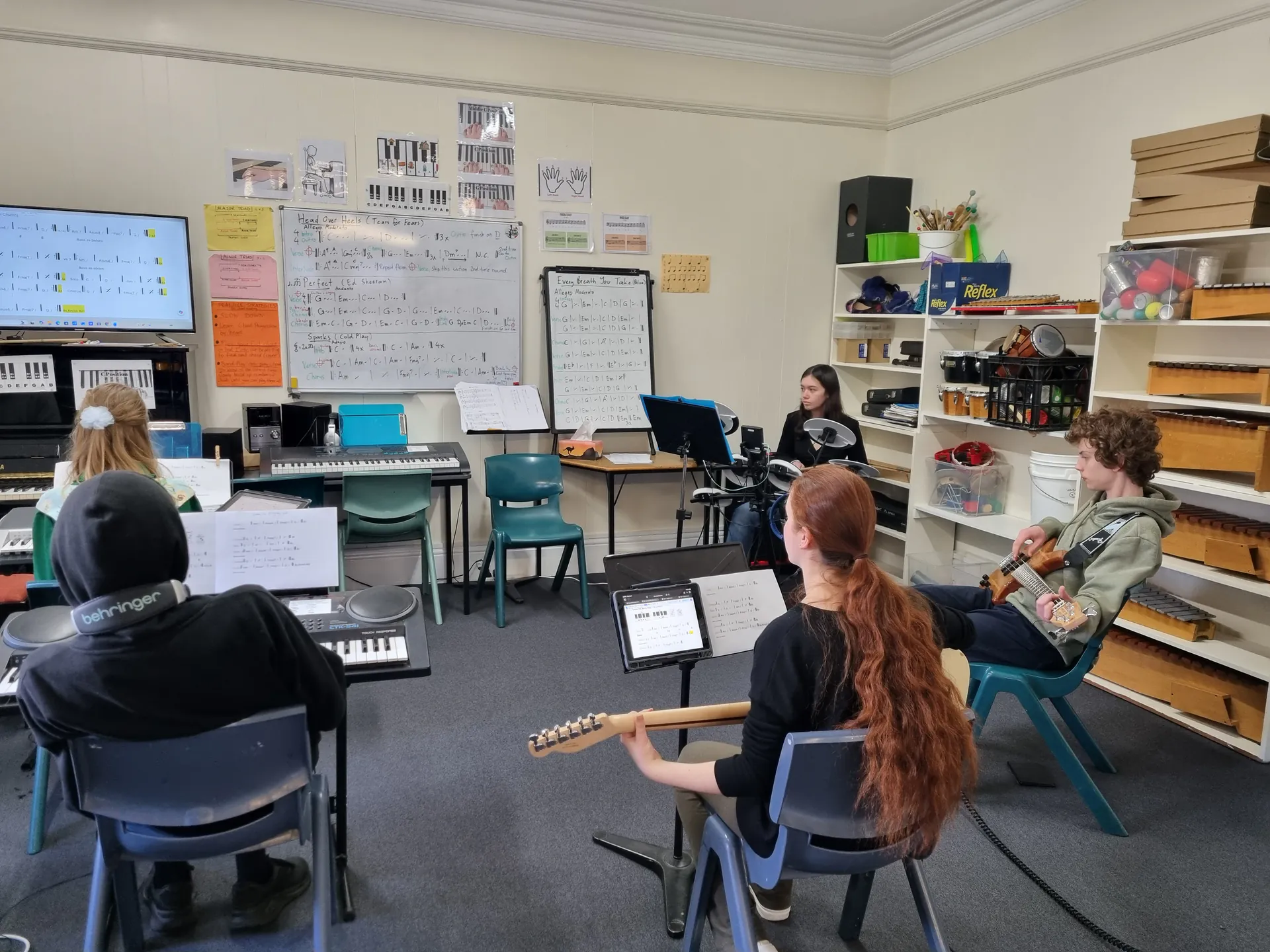 Year 9 students rehearsing together in music class